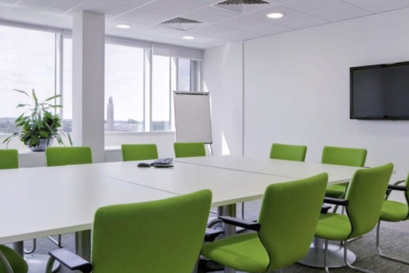 green chairs in a conference room